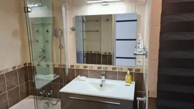 a bathroom with a sink and a shower and a mirror at 1 mn CROISETTE près Martinez in Cannes