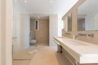a bathroom with a sink and a mirror at Appartement 3 chambres 125 m2 avec vue exceptionnelle face à la mer in Cannes