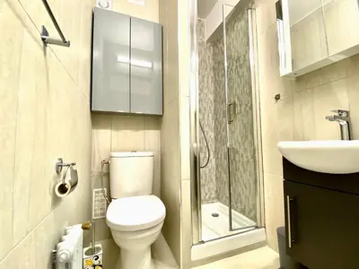 a small bathroom with a toilet and a sink at Château Picaud By SCLS Locations in Cannes