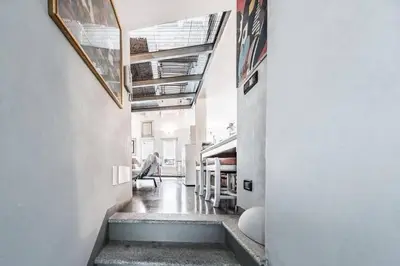 a hallway with a staircase in a house at Le Port Luxury Loft Duplex in Cannes
