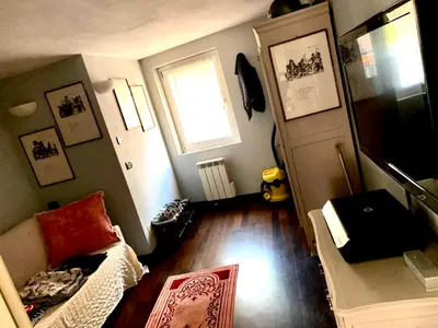 a small room with a couch and a window at Le Port Luxury Loft Duplex in Cannes