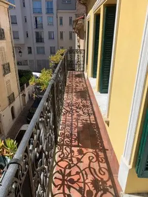 a balcony of a building with a wrought iron fence at Le Port Luxury Loft Duplex in Cannes