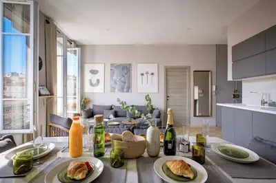 a table with plates of food on it in a kitchen at 3 chambres - Marché Forville - Proche du Palais in Cannes