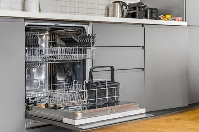 a dishwasher with dishes in it in a kitchen at 3 chambres - Marché Forville - Proche du Palais in Cannes