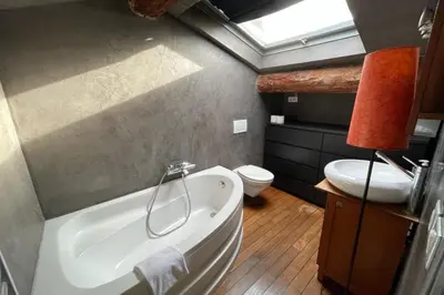 a bathroom with a tub and a toilet and a sink at Riouffe 2 bedroom duplex apartment in the center of Cannes in Cannes