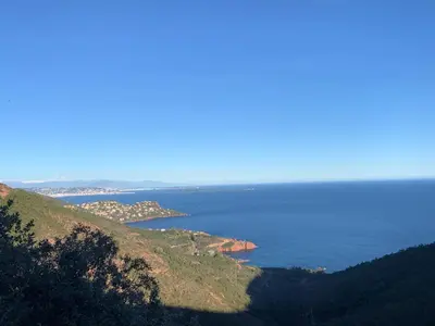 a view of the ocean from the top of a hill at APPARTEMENT WOOD DESING PROCHE CANNES in Le Cannet