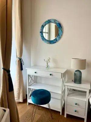 a white desk with a blue chair and a mirror at LB Vacation Rentals I Large Superieure Room with Balcony I Casa d'Azur in Cannes