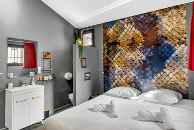 a bathroom with a sink and a toilet at Magnifique Loft industriel, forville, centre de Cannes  in Cannes