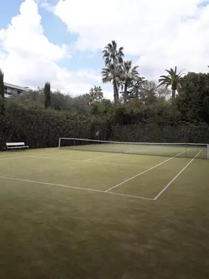 a tennis court with a net on top of it at IDEAL POUR COUPLE in Cannes