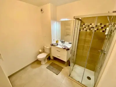 a bathroom with a shower and a toilet and a sink at PAUL DOUMER #1 By SCLS Locations in Le Cannet