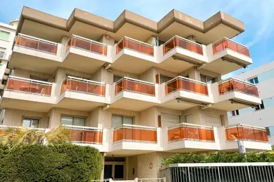 a building with balconies on the side of it at 2 bedroom apartment with parking 3 mins from La Croisette beach in Cannes