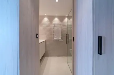 a bathroom with a walk in shower and a toilet at 1-Br Apartment Sea View Terrace & Parking in Cannes