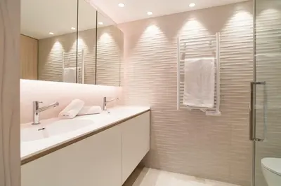 a bathroom with a sink and a mirror at 1-Br Apartment Sea View Terrace & Parking in Cannes