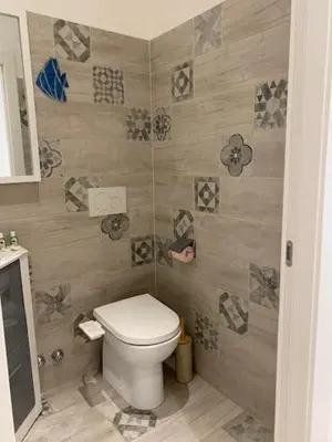 a bathroom with a toilet in a room at M.M.R. Au cœur de la vie cannoise in Cannes