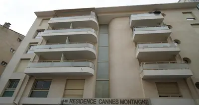 a building with balconies on the side of it at Apartment Montaigne in Cannes
