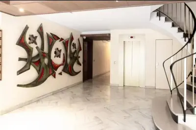 a hallway with a mural of cats on the wall at ESCURIAL Bel appart rénové proche Croisette et plage in Cannes