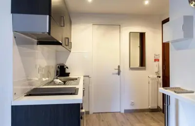 a kitchen with a sink and a stove top oven at ESCURIAL Bel appart rénové proche Croisette et plage in Cannes