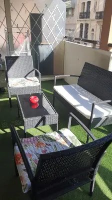 a group of chairs and a table on a balcony at T2 Cannes center in Cannes