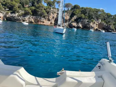 a boat in a body of water with blue water at T2 Cannes center in Cannes