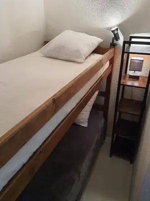 a bunk bed in a room with a ladder at T2 Cannes center in Cannes