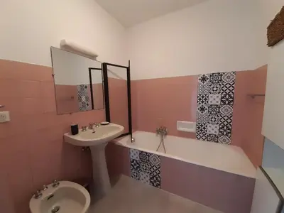 a bathroom with a sink and a toilet at Le République in Cannes