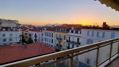 a view from a balcony of a city at sunset at Le République in Cannes