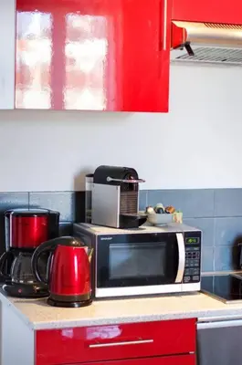 a microwave oven sitting on a counter in a kitchen at Lovely one bedroom apartment Gambetta Cannes in Cannes