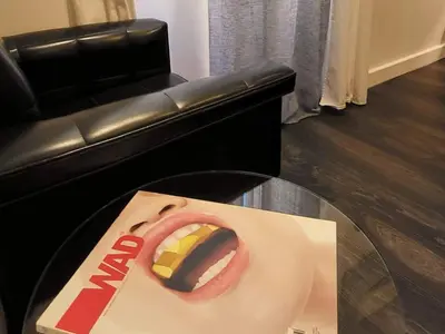 a box of food sitting on a table next to a couch at Cannes apartment - city center, AC / wifi in Cannes