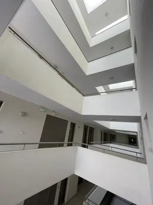 an office building with a skylight in the ceiling at Studio Piscine & Parking by Connexion in Cannes