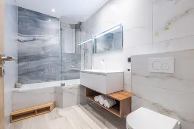 a bathroom with a shower and a sink and a toilet at Residence Meynadier - apartments - New - AC - Wifi - Close Beach and Palais - LRA Cannes in Cannes