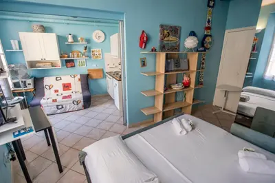 a living room with a bed and a kitchen at Le Suquet Style III by Connexion in Cannes