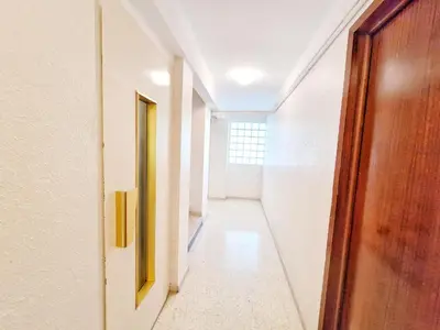 a hallway with a wooden door and a hallwayngth at Cannes Appartement Palais Festivals in Cannes