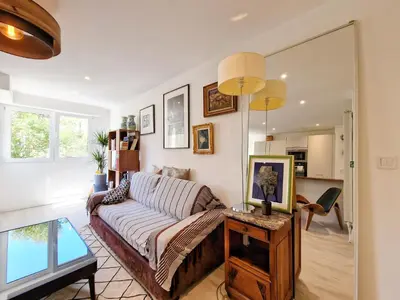 a living room with a couch and a table at Cannes Appartement Palais Festivals in Cannes