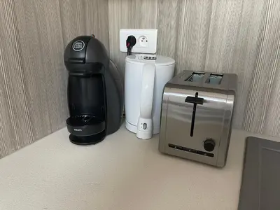 a coffee maker and a coffeemaker sitting on the floor at Studio cosy à côté du Palais des festivals in Cannes