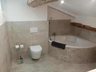 a bathroom with a toilet and a bath tub at Studio cosy à côté du Palais des festivals in Cannes