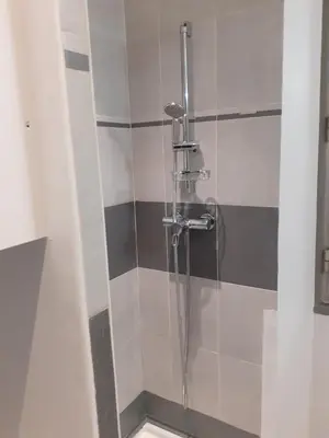 a shower in a bathroom with a glass door at FORVILLE APARTMENT Cannes in Cannes