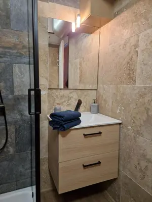 a bathroom with a sink and a shower at Apartment Rue St Antoine in Cannes
