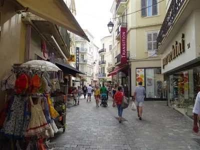 a group of people walking down a street at Apartment Rue St Antoine in Cannes