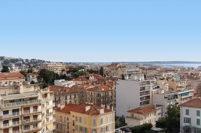 an aerial view of a city with buildings at Superbe appartement à Cannes vue mer panoramique 