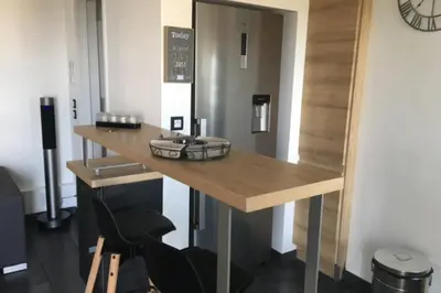 a dressing room with a table and two chairs at Cosy 42m With Balcony Nice View And Wifi in Cannes
