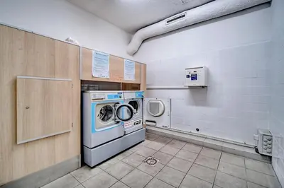 a laundry room with a washing machine and a washer at Agréable 2 pièces TERRASSE, PISCINE, Clémenceau A1B235 in Cannes
