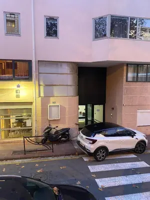 a white car parked in front of a building at Agréable 2 pièces TERRASSE, PISCINE, Clémenceau A1B235 in Cannes