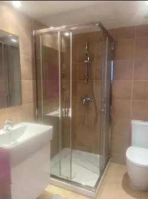 a bathroom with a shower with a sink and a toilet at palm Beach studio vue port Canto in Cannes