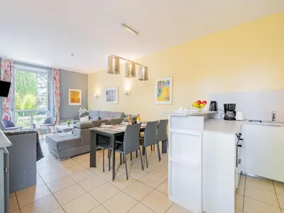 a kitchen and living room with a table and chairs at Apartment Villa Francia-1 by Interhome in Cannes