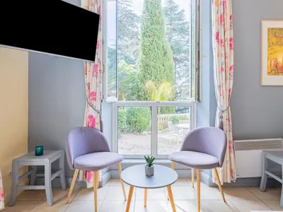 a living room with two chairs and a window at Apartment Villa Francia-1 by Interhome in Cannes