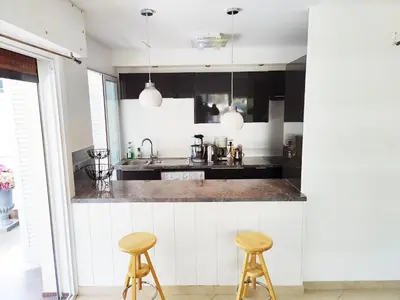 a living room with a couch and a television at One bedroom flat with terrace, 250m from the beach and La Croisette, Behind the Martinez Hotel in Cannes