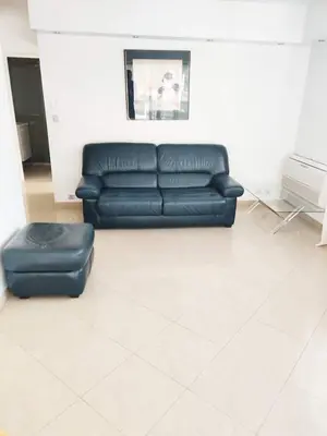 a bedroom with a bed and a large window at One bedroom flat with terrace, 250m from the beach and La Croisette, Behind the Martinez Hotel in Cannes