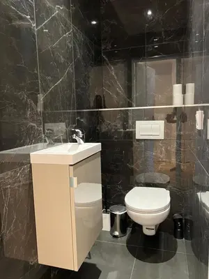 a bathroom with a white toilet and a sink at Cosy 2 bedrooms apartment Croisette in Cannes