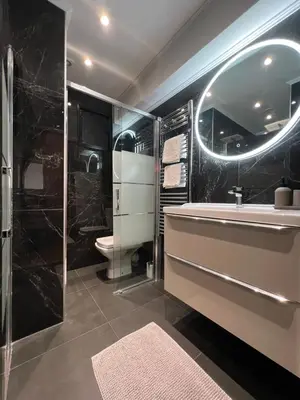 a bathroom with a tub and a sink and a toilet at Cosy 2 bedrooms apartment Croisette in Cannes