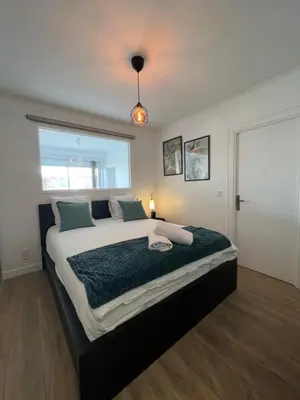 a bedroom with a large bed with a large window at Cosy 2 bedrooms apartment Croisette in Cannes